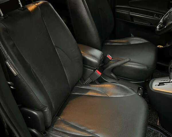 Черный Хендай Туксон, объемом двигателя 2 л и пробегом 151 тыс. км за 9100 $, фото 22 на Automoto.ua