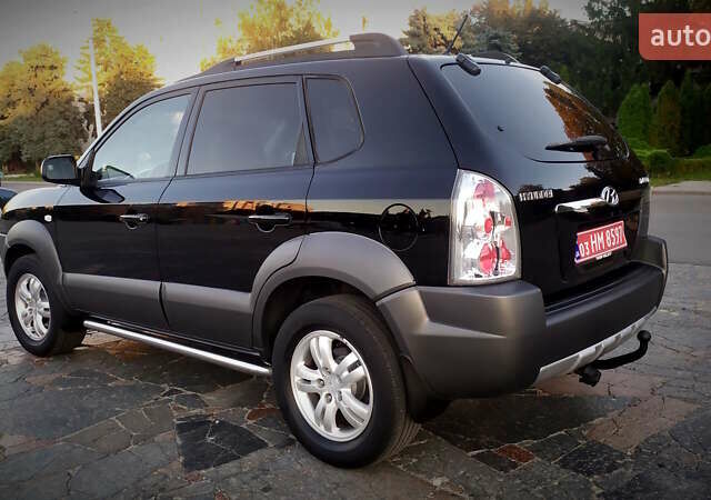 Черный Хендай Туксон, объемом двигателя 2 л и пробегом 230 тыс. км за 8600 $, фото 105 на Automoto.ua
