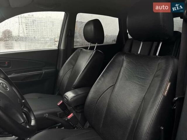Черный Хендай Туксон, объемом двигателя 1.98 л и пробегом 260 тыс. км за 6900 $, фото 11 на Automoto.ua