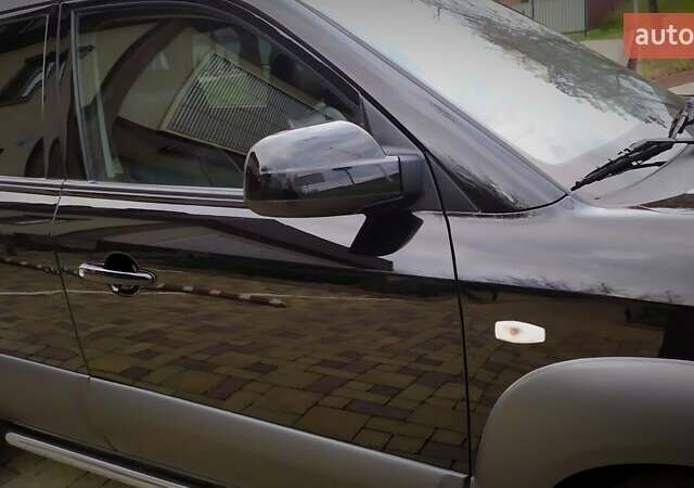 Чорний Хендай Туксон, об'ємом двигуна 2 л та пробігом 229 тис. км за 8600 $, фото 67 на Automoto.ua