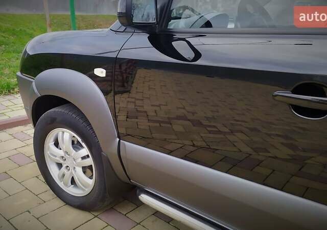 Чорний Хендай Туксон, об'ємом двигуна 2 л та пробігом 229 тис. км за 8600 $, фото 91 на Automoto.ua