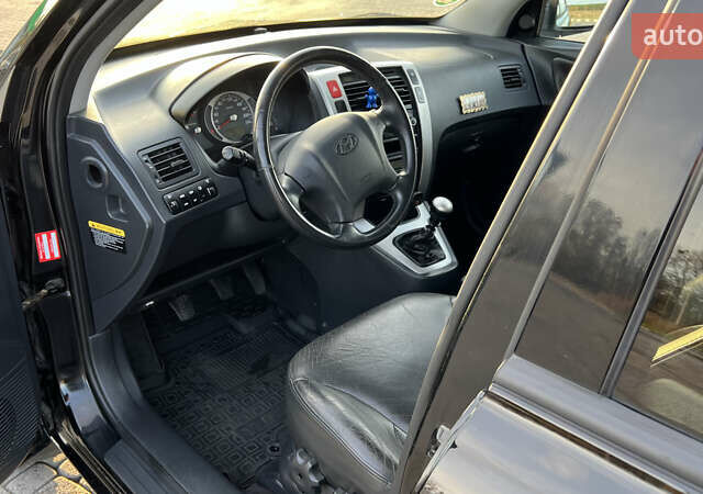 Черный Хендай Туксон, объемом двигателя 1.98 л и пробегом 243 тыс. км за 8500 $, фото 40 на Automoto.ua