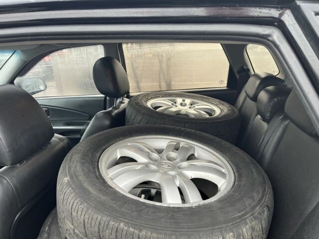 Черный Хендай Туксон, объемом двигателя 2 л и пробегом 177 тыс. км за 8500 $, фото 8 на Automoto.ua