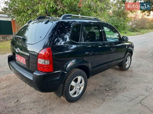 Черный Хендай Туксон, объемом двигателя 2 л и пробегом 219 тыс. км за 7990 $, фото 31 на Automoto.ua