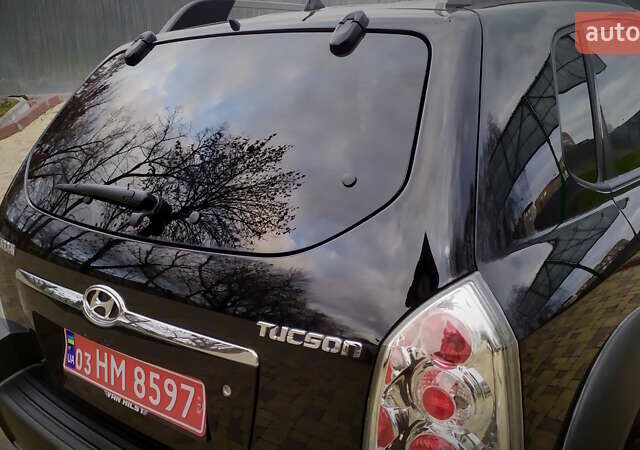 Чорний Хендай Туксон, об'ємом двигуна 2 л та пробігом 229 тис. км за 8600 $, фото 75 на Automoto.ua
