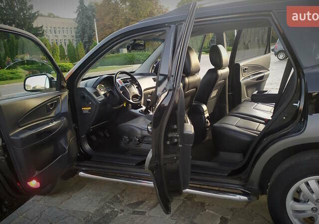 Черный Хендай Туксон, объемом двигателя 2 л и пробегом 230 тыс. км за 8600 $, фото 194 на Automoto.ua