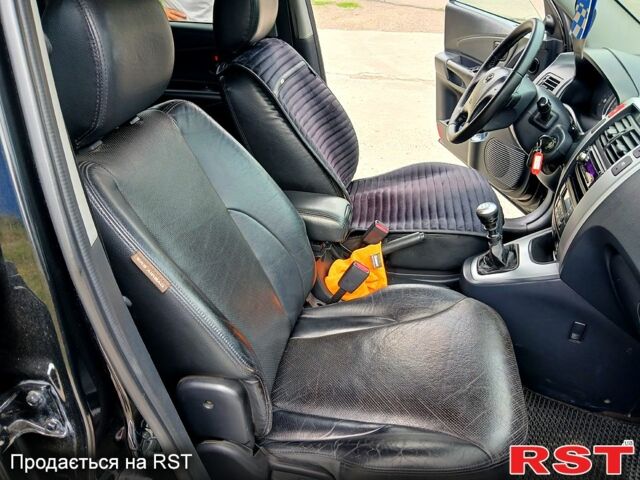 Черный Хендай Туксон, объемом двигателя 2 л и пробегом 235 тыс. км за 7900 $, фото 7 на Automoto.ua