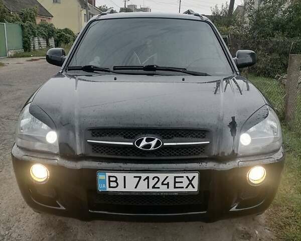 Черный Хендай Туксон, объемом двигателя 1.98 л и пробегом 238 тыс. км за 8400 $, фото 7 на Automoto.ua