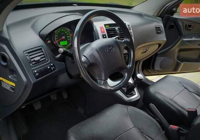 Чорний Хендай Туксон, об'ємом двигуна 2 л та пробігом 229 тис. км за 8600 $, фото 107 на Automoto.ua