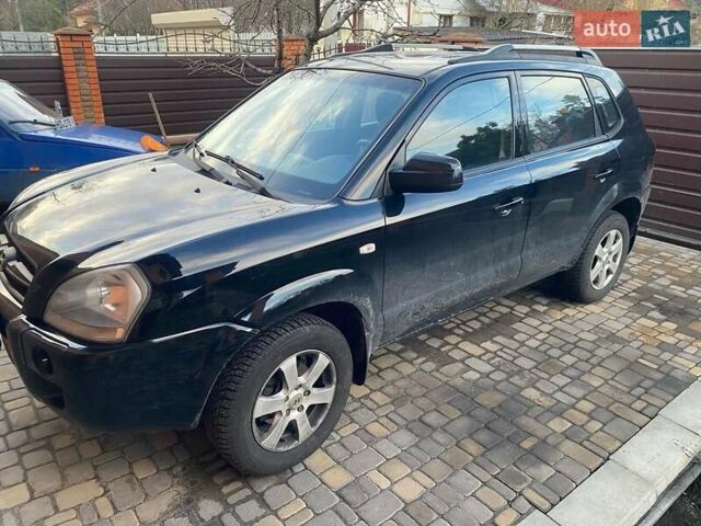 Черный Хендай Туксон, объемом двигателя 2 л и пробегом 84 тыс. км за 8650 $, фото 4 на Automoto.ua