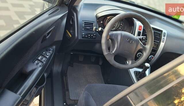 Черный Хендай Туксон, объемом двигателя 2 л и пробегом 190 тыс. км за 8150 $, фото 27 на Automoto.ua