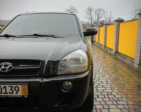 Черный Хендай Туксон, объемом двигателя 2 л и пробегом 151 тыс. км за 9100 $, фото 3 на Automoto.ua