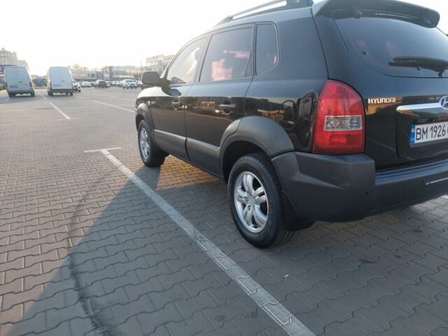 Черный Хендай Туксон, объемом двигателя 2 л и пробегом 289 тыс. км за 6600 $, фото 3 на Automoto.ua
