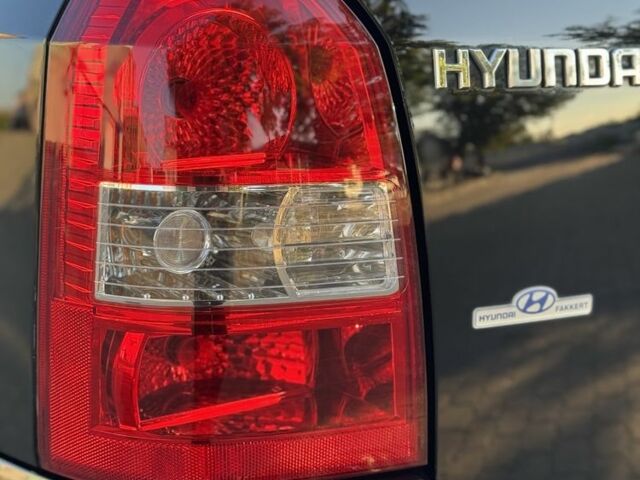 Черный Хендай Туксон, объемом двигателя 2 л и пробегом 180 тыс. км за 7800 $, фото 6 на Automoto.ua