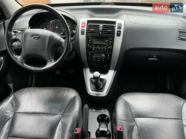 Черный Хендай Туксон, объемом двигателя 2 л и пробегом 180 тыс. км за 7700 $, фото 29 на Automoto.ua