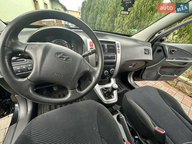 Черный Хендай Туксон, объемом двигателя 2 л и пробегом 218 тыс. км за 7600 $, фото 30 на Automoto.ua