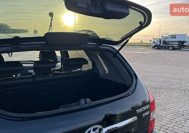 Черный Хендай Туксон, объемом двигателя 1.98 л и пробегом 243 тыс. км за 8500 $, фото 22 на Automoto.ua