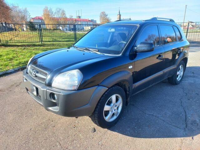 Черный Хендай Туксон, объемом двигателя 2 л и пробегом 227 тыс. км за 7300 $, фото 3 на Automoto.ua