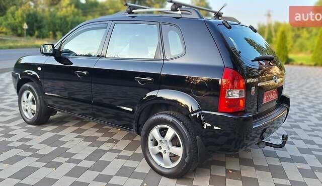 Черный Хендай Туксон, объемом двигателя 2 л и пробегом 190 тыс. км за 8300 $, фото 12 на Automoto.ua