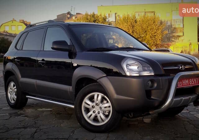 Черный Хендай Туксон, объемом двигателя 2 л и пробегом 230 тыс. км за 8600 $, фото 28 на Automoto.ua