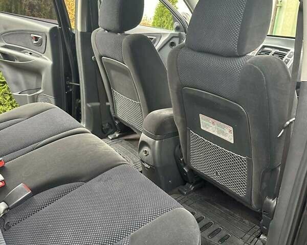 Черный Хендай Туксон, объемом двигателя 2 л и пробегом 218 тыс. км за 7600 $, фото 13 на Automoto.ua