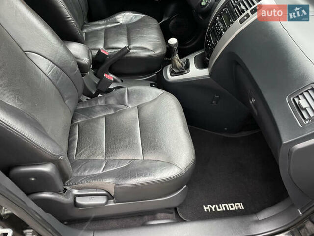 Черный Хендай Туксон, объемом двигателя 2 л и пробегом 180 тыс. км за 7700 $, фото 30 на Automoto.ua