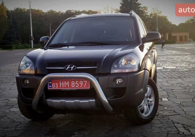 Черный Хендай Туксон, объемом двигателя 2 л и пробегом 230 тыс. км за 8600 $, фото 1 на Automoto.ua