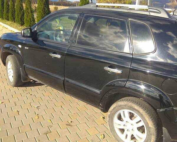 Черный Хендай Туксон, объемом двигателя 2 л и пробегом 277 тыс. км за 7900 $, фото 7 на Automoto.ua