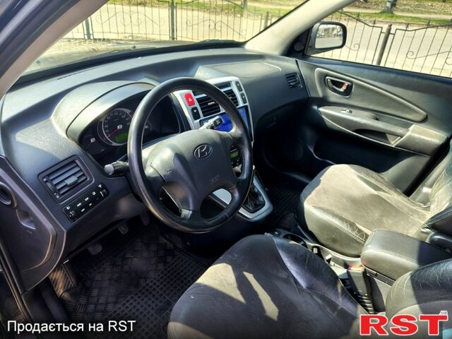 Чорний Хендай Туксон, об'ємом двигуна 2 л та пробігом 350 тис. км за 7500 $, фото 7 на Automoto.ua