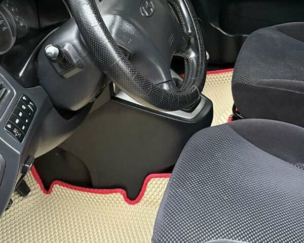 Черный Хендай Туксон, объемом двигателя 1.98 л и пробегом 273 тыс. км за 7400 $, фото 10 на Automoto.ua