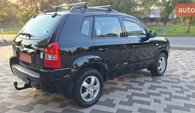 Черный Хендай Туксон, объемом двигателя 2 л и пробегом 190 тыс. км за 8150 $, фото 8 на Automoto.ua