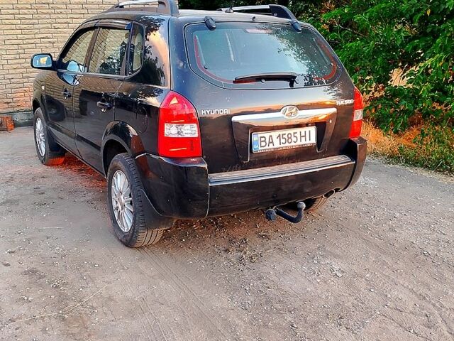 Черный Хендай Туксон, объемом двигателя 2 л и пробегом 183 тыс. км за 7900 $, фото 3 на Automoto.ua