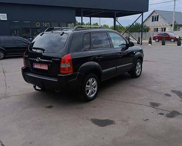 Черный Хендай Туксон, объемом двигателя 2 л и пробегом 255 тыс. км за 8400 $, фото 10 на Automoto.ua