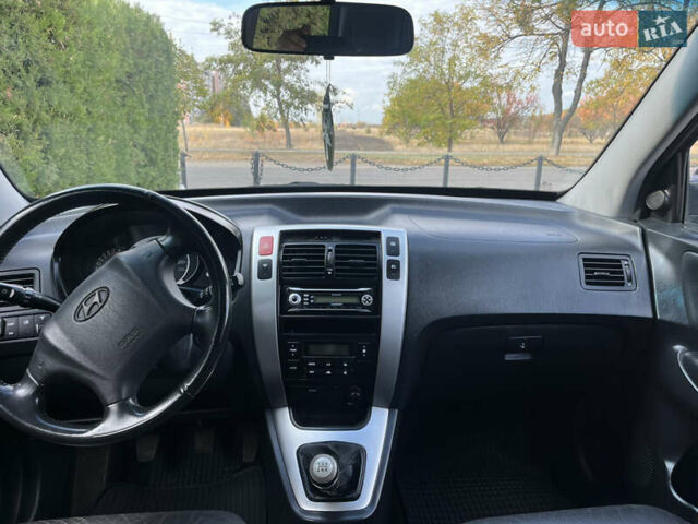 Черный Хендай Туксон, объемом двигателя 2 л и пробегом 256 тыс. км за 7800 $, фото 22 на Automoto.ua