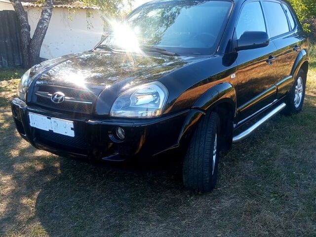 Черный Хендай Туксон, объемом двигателя 2 л и пробегом 236 тыс. км за 8300 $, фото 1 на Automoto.ua