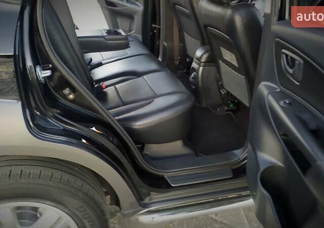Черный Хендай Туксон, объемом двигателя 2 л и пробегом 230 тыс. км за 8600 $, фото 181 на Automoto.ua