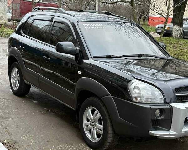 Черный Хендай Туксон, объемом двигателя 1.98 л и пробегом 273 тыс. км за 7400 $, фото 5 на Automoto.ua