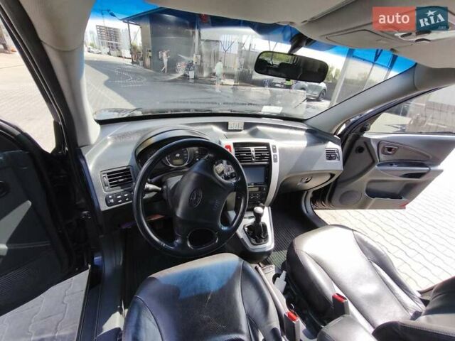 Черный Хендай Туксон, объемом двигателя 2 л и пробегом 158 тыс. км за 7500 $, фото 23 на Automoto.ua