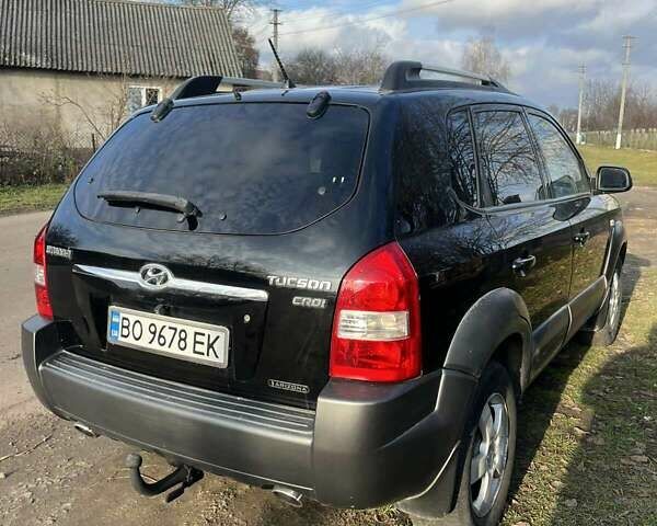 Черный Хендай Туксон, объемом двигателя 1.99 л и пробегом 302 тыс. км за 6900 $, фото 2 на Automoto.ua