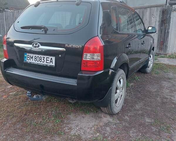 Черный Хендай Туксон, объемом двигателя 1.98 л и пробегом 200 тыс. км за 7100 $, фото 8 на Automoto.ua