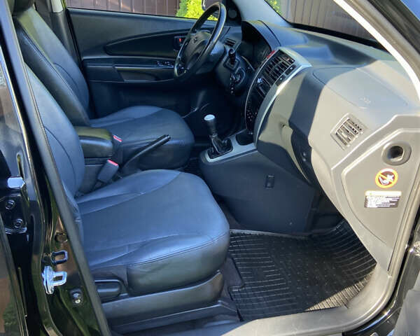 Черный Хендай Туксон, объемом двигателя 1.98 л и пробегом 197 тыс. км за 8000 $, фото 29 на Automoto.ua