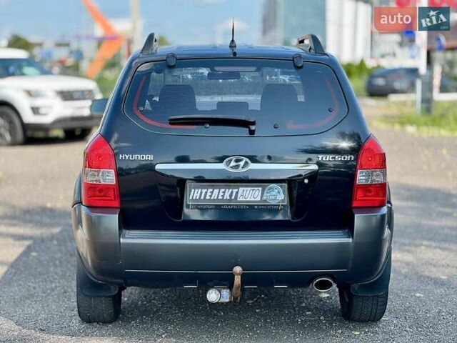 Черный Хендай Туксон, объемом двигателя 2 л и пробегом 227 тыс. км за 8200 $, фото 4 на Automoto.ua