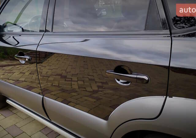 Чорний Хендай Туксон, об'ємом двигуна 2 л та пробігом 229 тис. км за 8600 $, фото 85 на Automoto.ua