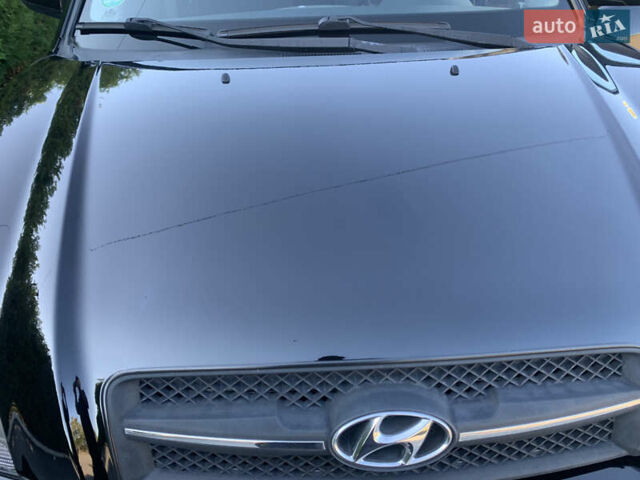 Чорний Хендай Туксон, об'ємом двигуна 2 л та пробігом 56 тис. км за 9500 $, фото 24 на Automoto.ua