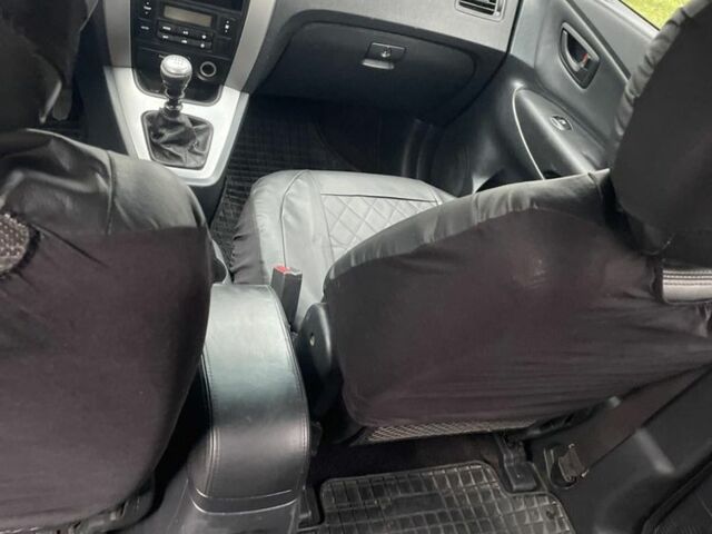 Чорний Хендай Туксон, об'ємом двигуна 2 л та пробігом 230 тис. км за 5999 $, фото 6 на Automoto.ua