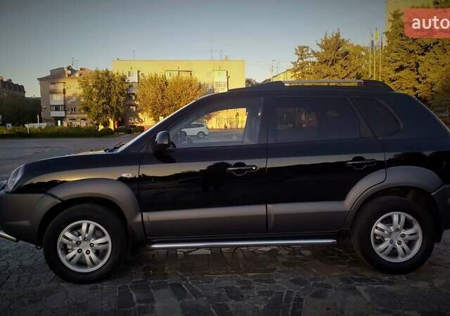 Черный Хендай Туксон, объемом двигателя 2 л и пробегом 230 тыс. км за 8600 $, фото 9 на Automoto.ua