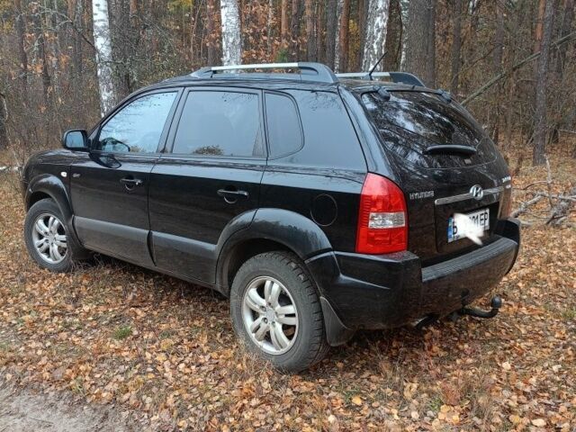 Черный Хендай Туксон, объемом двигателя 2 л и пробегом 240 тыс. км за 8800 $, фото 3 на Automoto.ua