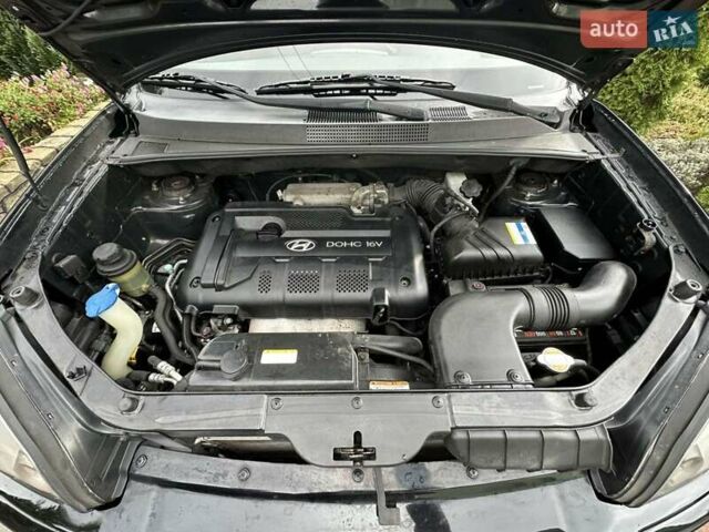 Черный Хендай Туксон, объемом двигателя 2 л и пробегом 218 тыс. км за 7600 $, фото 25 на Automoto.ua