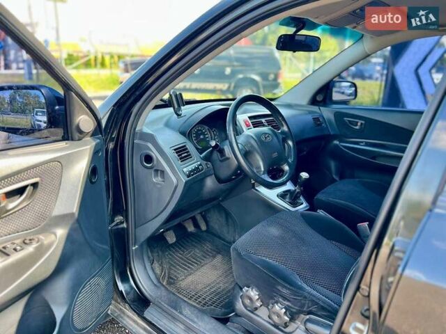 Черный Хендай Туксон, объемом двигателя 2 л и пробегом 227 тыс. км за 8200 $, фото 14 на Automoto.ua
