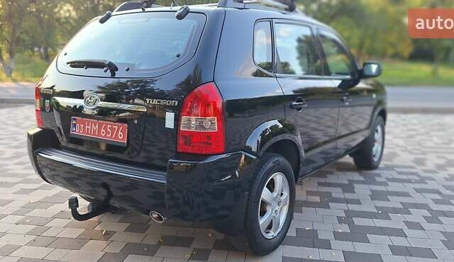 Черный Хендай Туксон, объемом двигателя 2 л и пробегом 190 тыс. км за 8150 $, фото 9 на Automoto.ua